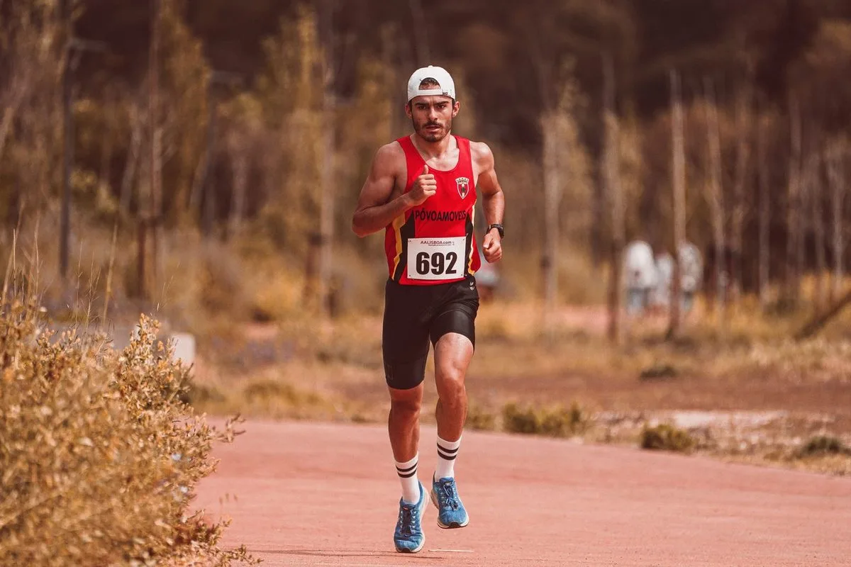 Distance runner training outdoors on a trail