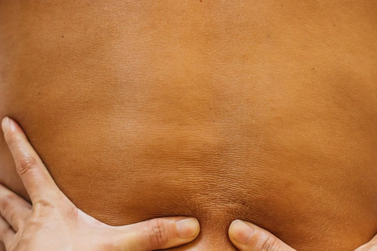 Hands-on myofascial release therapy on a patient's back