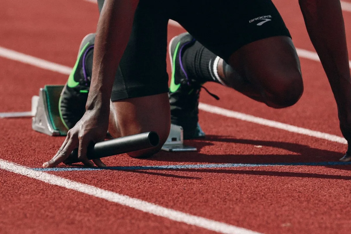 Sprinter in starting blocks on a running track